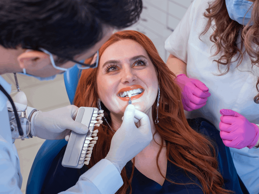 Woman having teeth whitening treatment performed